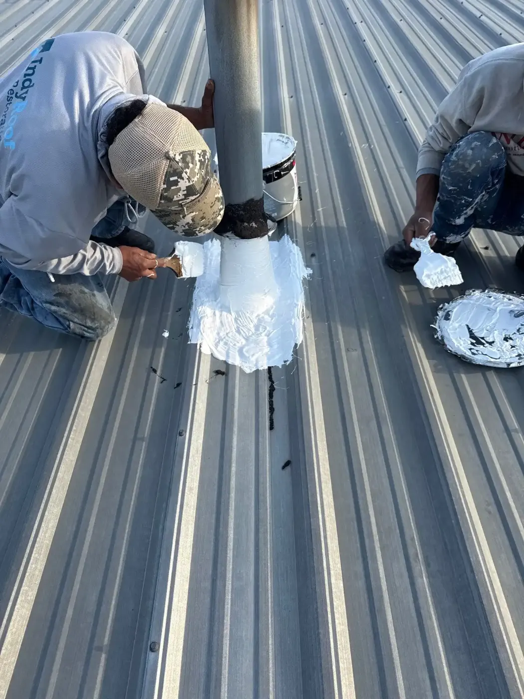Tarping and dry-in on a Versailles commercial roof